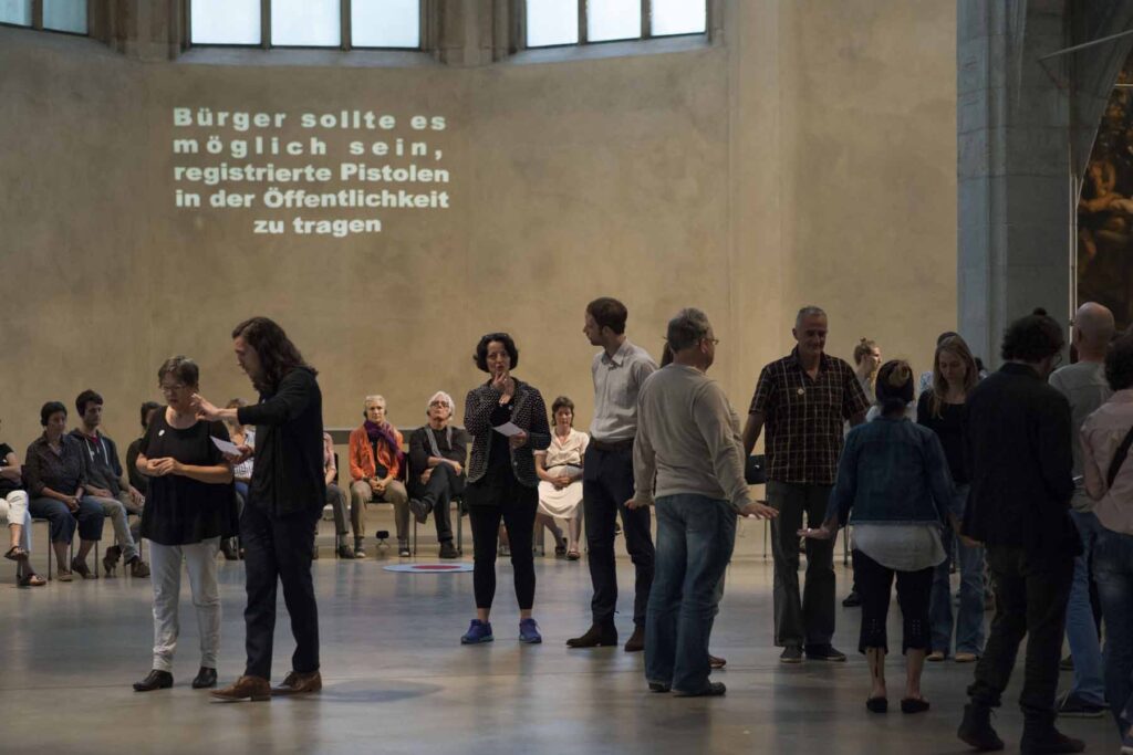 Participants walking, gesturing and listening in The Exchange, Cologne. Photo: Almut Elhardt