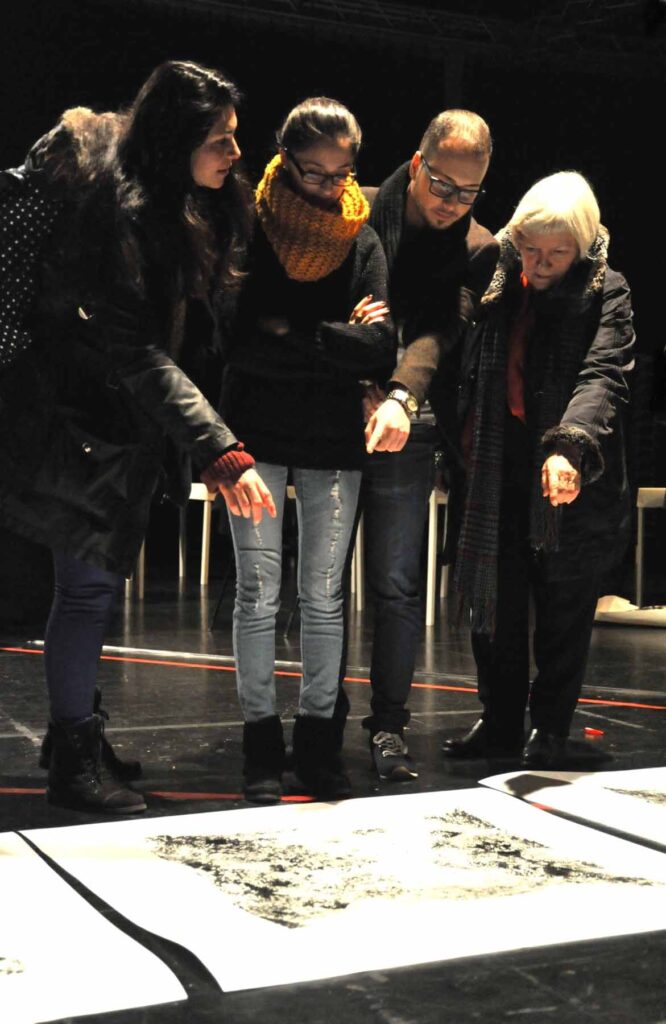 Participants in Knotunknot, answering looking at painted images. Photo: Marion Borriss