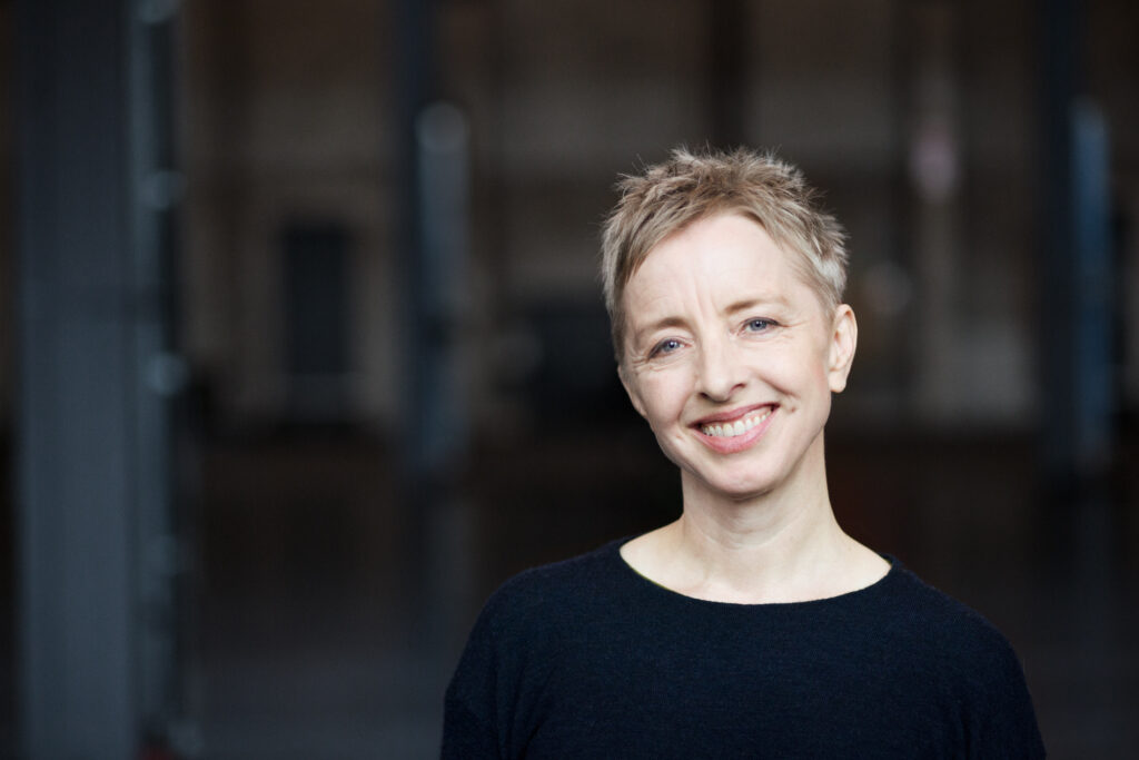 headshot, tilted head smile. smaller jpg, big enough for most press purposes